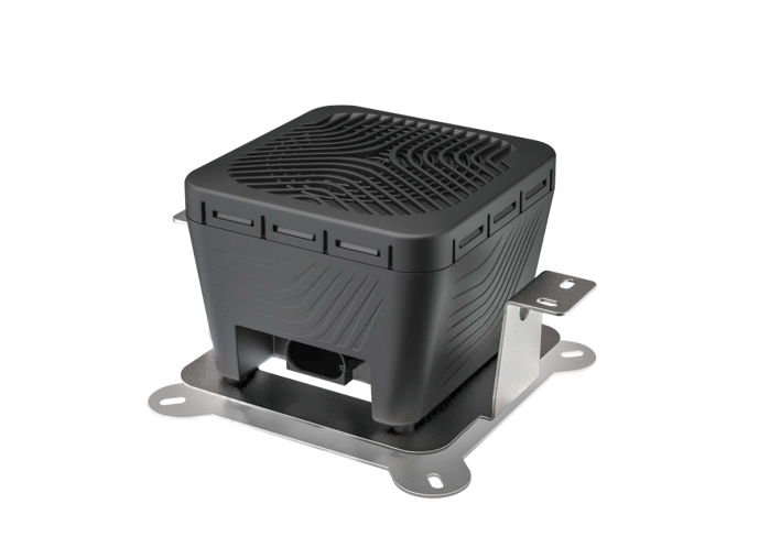 AVAS – acoustic warning system for electric vehicles from Continental, consisting of a black square plastic housing with speaker holes on the top, mounted on a silver-colored carrier plate with mounting holes on all four corners. 